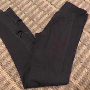Leggings with criss cut cut outs at bottom.